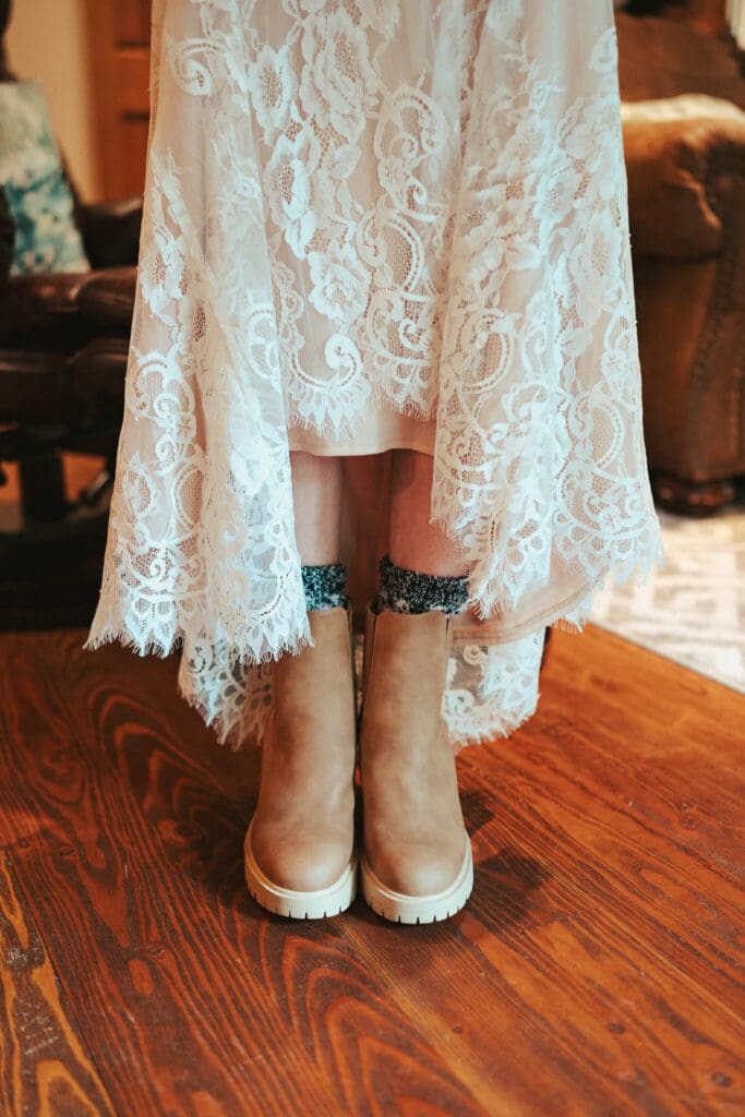 Bride wearing a lace wedding dress and boots during an intimate Artist Point elopement in the North Cascades.