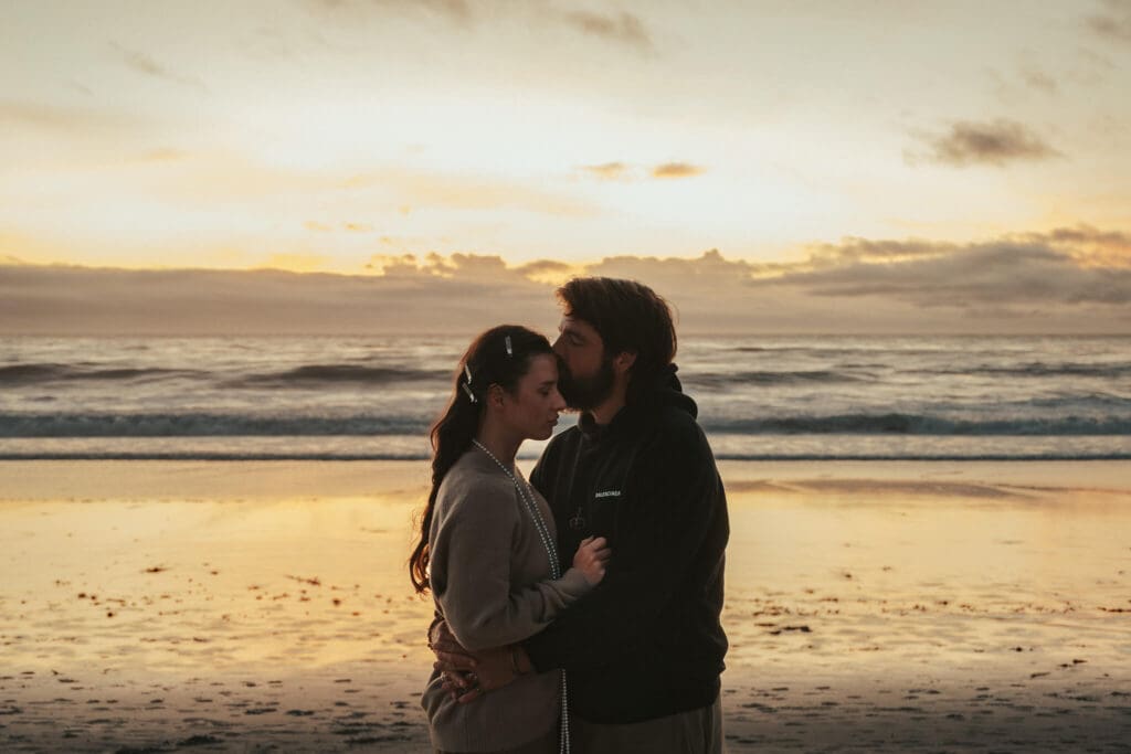 A romantic Pacific Grove beach elopement portrait at sunset, blending golden light with California coastal intimacy.