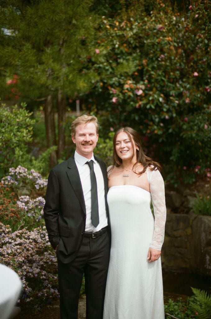 Backyard wedding couple portrait on color film in Shoreline Washington captured with timeless film wedding photography.