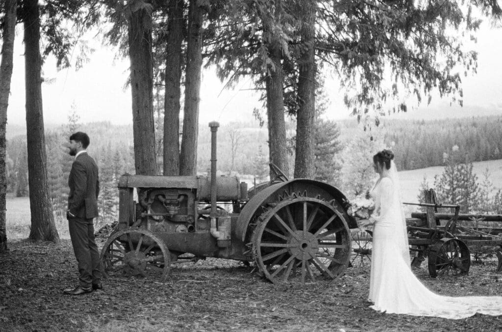 Black and white film wedding first look at Western Pleasure Guest Ranch in Sandpoint Idaho, captured with documentary-style film wedding photography.