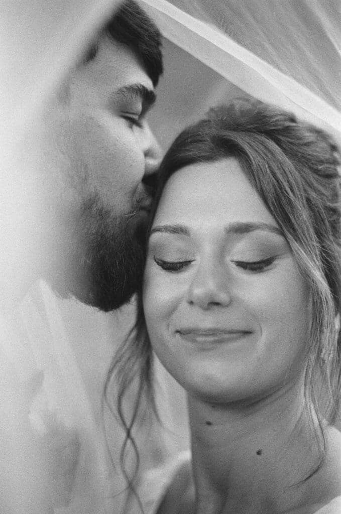 Intimate black and white film wedding portrait in Sandpoint Idaho showing emotional, documentary-style film photography on a wedding day.