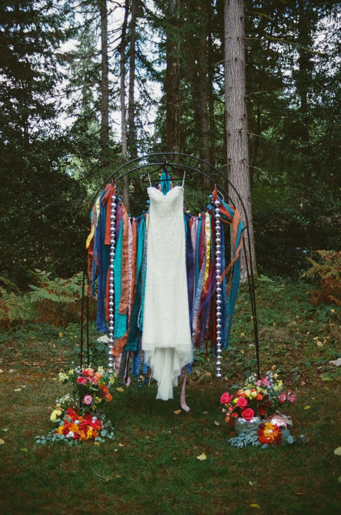 Wedding dress detail photographed on color film at Woodland Gardens Events on Vashon Island using fine art film wedding photography.
