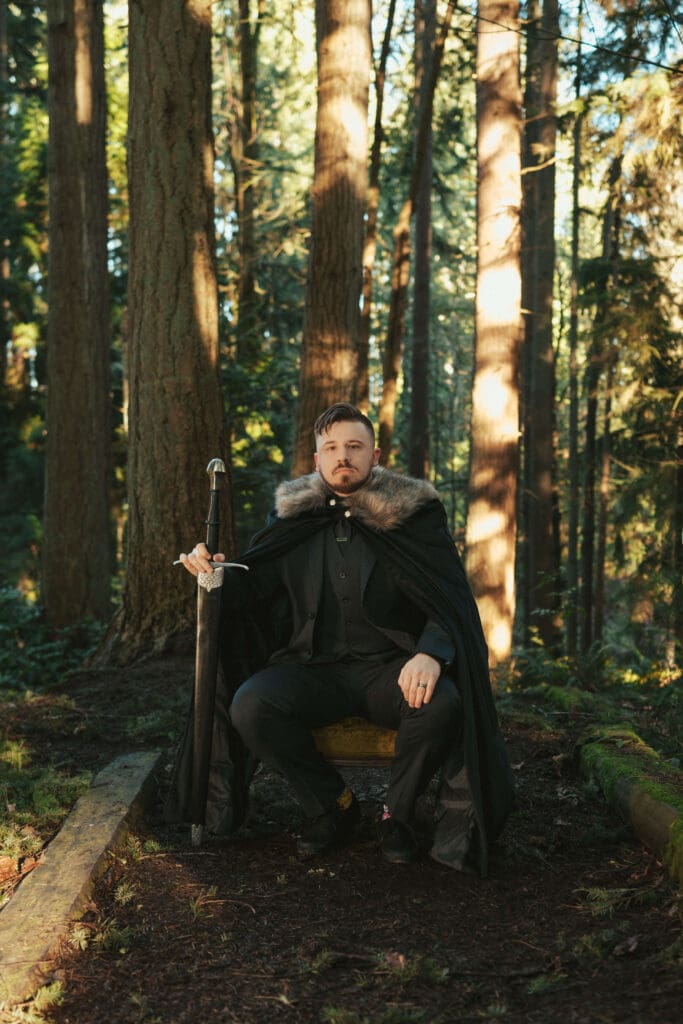 Groom portrait in an evergreen forest during a winter wedding session near Floral Hall in Everett, WA.
