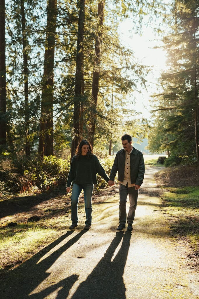 Romantic engagement photo of Ursula and Jack sharing a quiet moment with soft backlight at Flowing Lake County Park near Snohomish, WA.